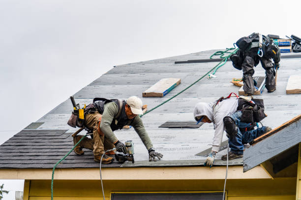 Professional Roofing technician working in Lowell, MA